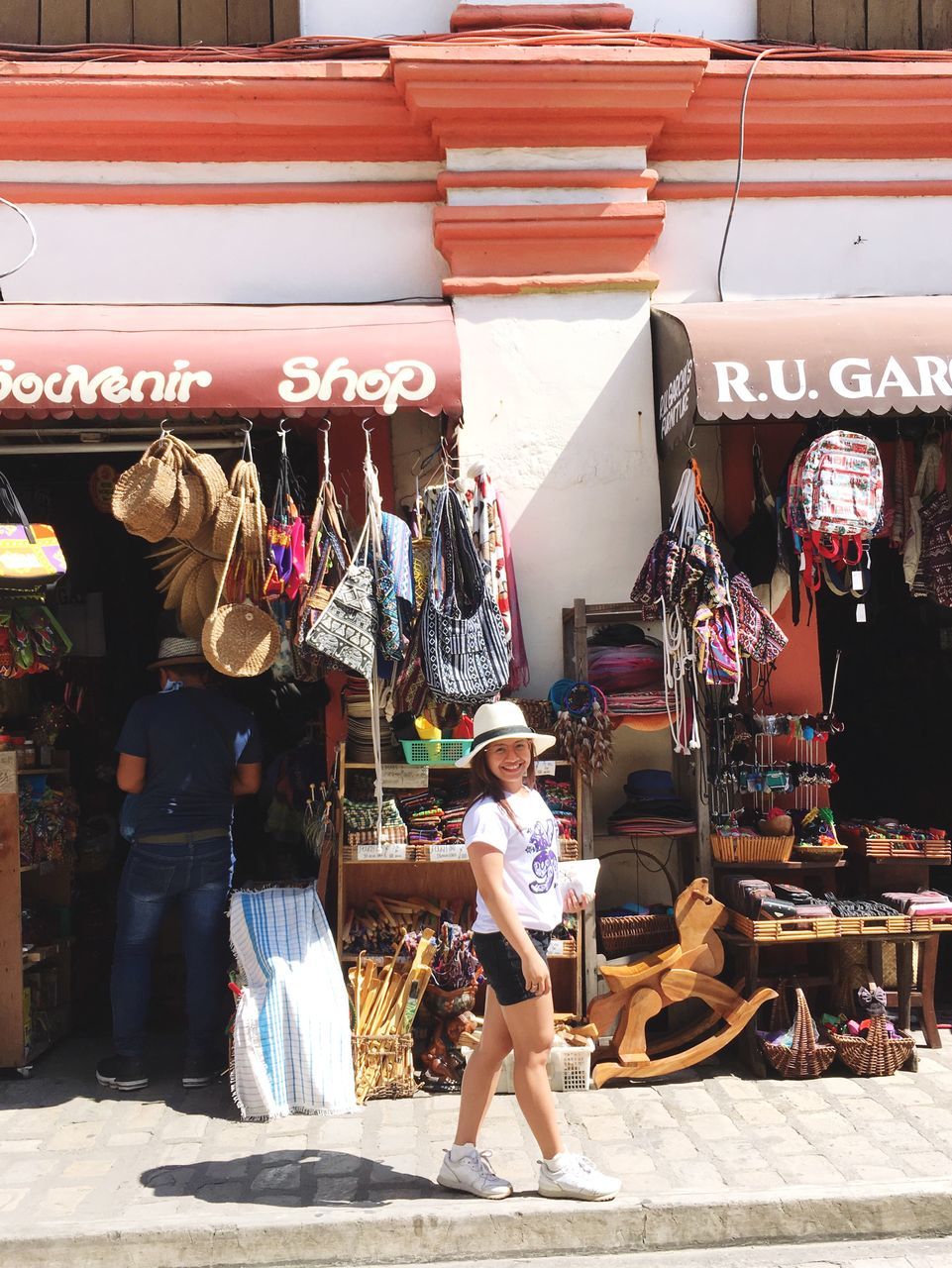 real people, market, retail, women, for sale, childhood, market stall, lifestyles, people, casual clothing, full length, day, child, built structure, text, leisure activity, architecture, men, adult, retail display, outdoors, sale