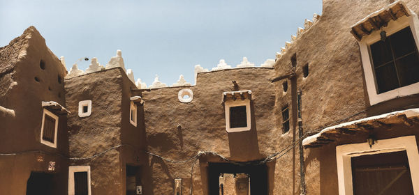 Low angle view of old building against sky