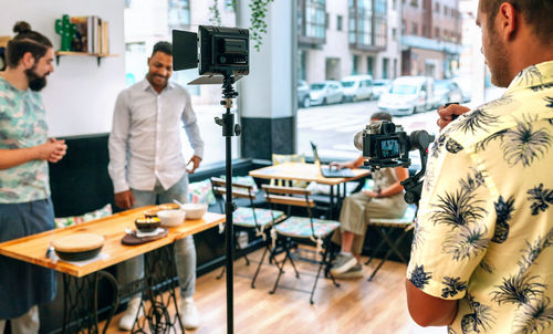 Cameraman recording a cooking tutorial that is broadcast live