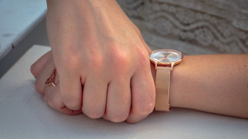 Hand of woman wearing a watch 