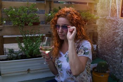 Portrait of beautiful woman drinking water