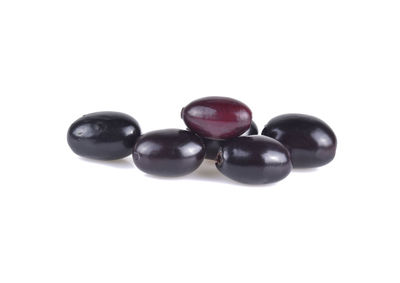 High angle view of black candies against white background