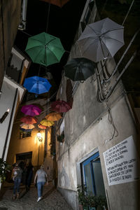 Low angle view of people at night