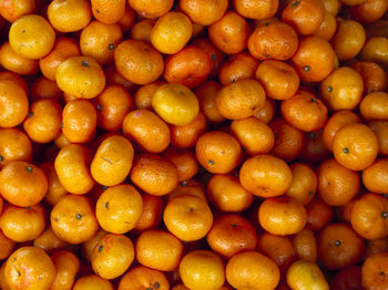 Full frame shot of oranges at market stall