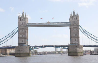 View of tower bridge over thames river against sky