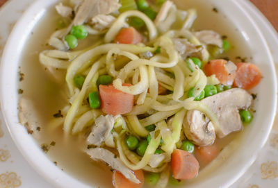 Close-up of chicken zoodle soup served in bowl