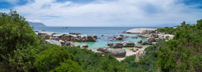 Panoramic view of rocks on beach against sky . boulders beach , cape town , south africa
