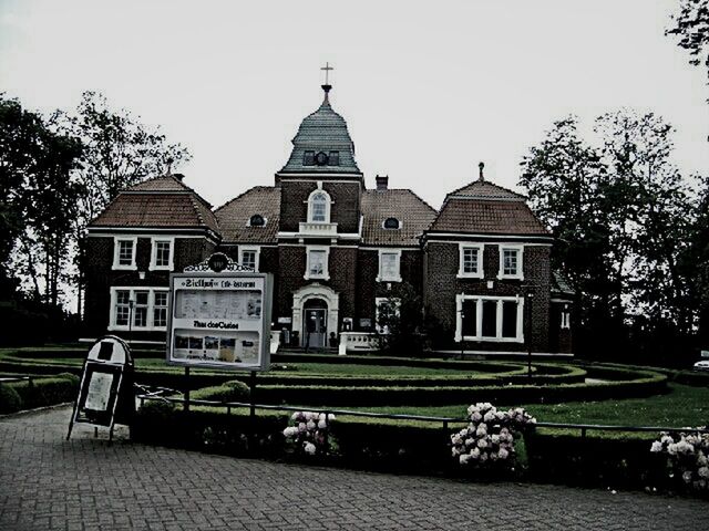 architecture, building exterior, built structure, place of worship, tree, religion, spirituality, lawn, grass, dome, facade, church, sky, clear sky, fountain, park - man made space, day, incidental people