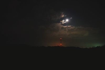 Scenic view of silhouette moon against sky at night