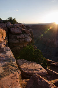 Rock formations on landscape against sky