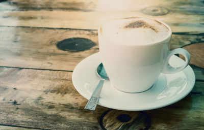 Close-up of coffee cup on table