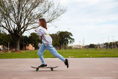 Portrait of girl skateboarding