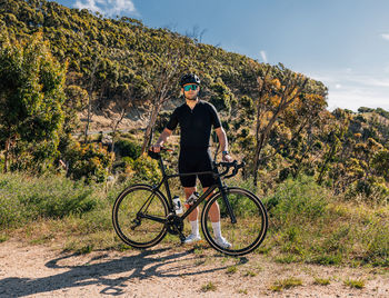 Man riding bicycle on mountain