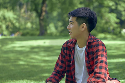 Young man looking away outdoors