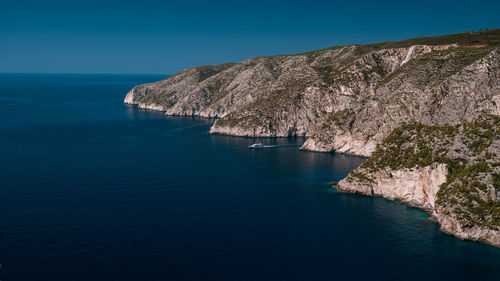 Scenic view of sea against clear blue sky