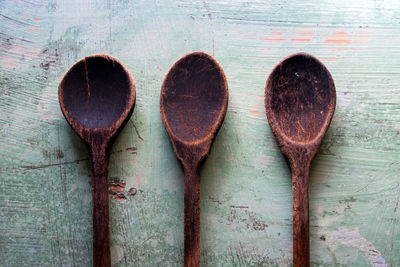 High angle view of wooden spoons on table