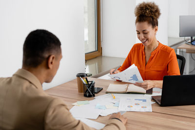 Side view of man working at office