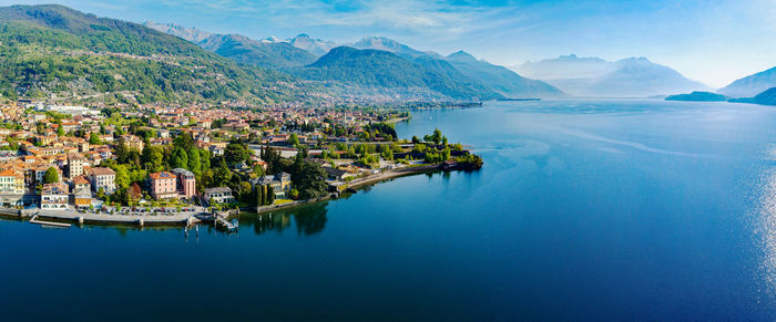 Panoramic view of sea and buildings against sky