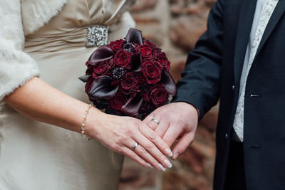 Close-up of couple holding hands