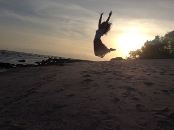 Scenic view of beach at sunset