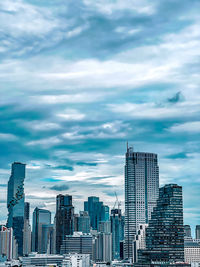 Modern buildings in city against sky