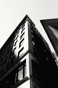 Low angle view of skyscraper against clear sky