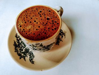 High angle view of coffee cup on table