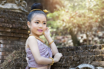 Portrait of young woman looking away