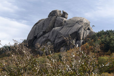 Low angle view of statue against sky