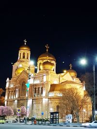 Low angle view of illuminated cathedral against clear sky at night