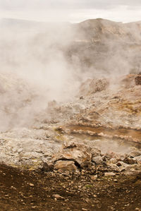 Scenic view of water flowing from sand