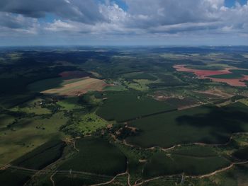 Aerial view of agricultural landscape against sky