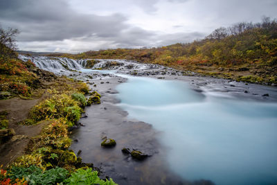 Scenic view of river against sky