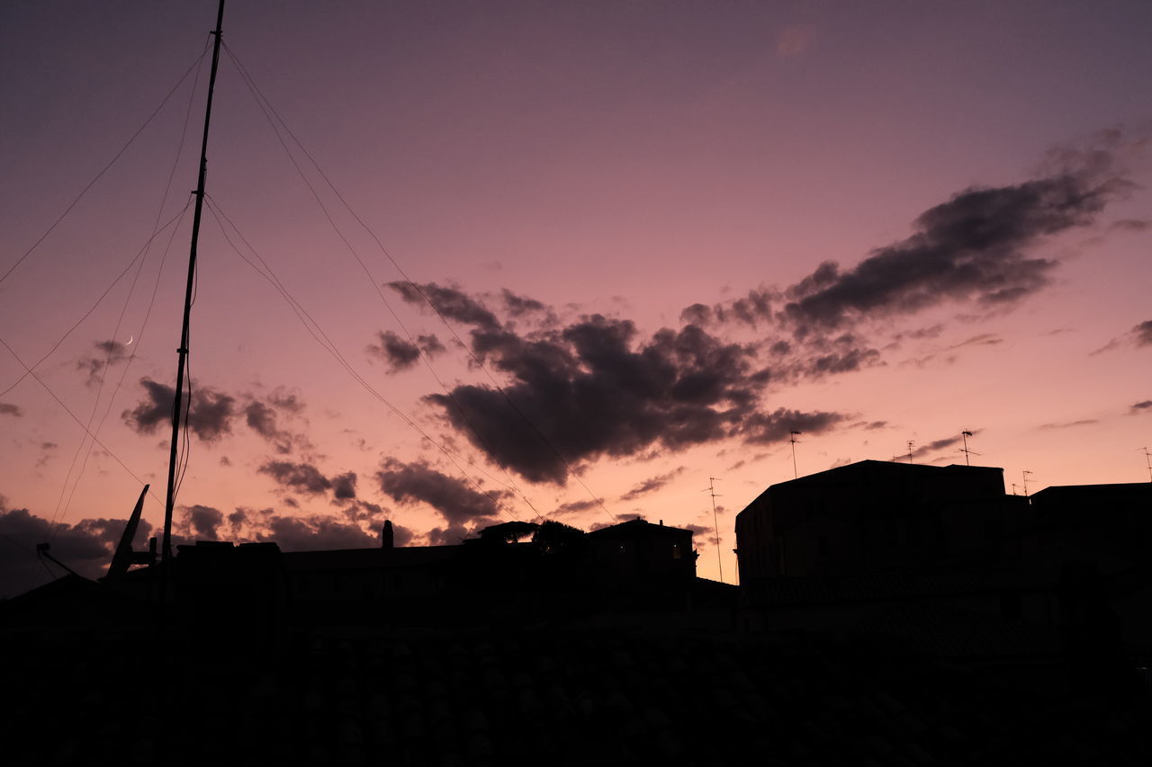 SILHOUETTE BUILDINGS AGAINST SKY DURING SUNSET