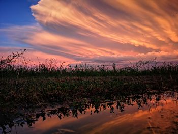 Scenic view of lake against sky during sunset