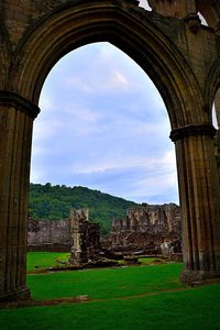 Ruins of historic building against sky