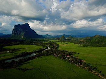 Scenic view of agricultural field against sky