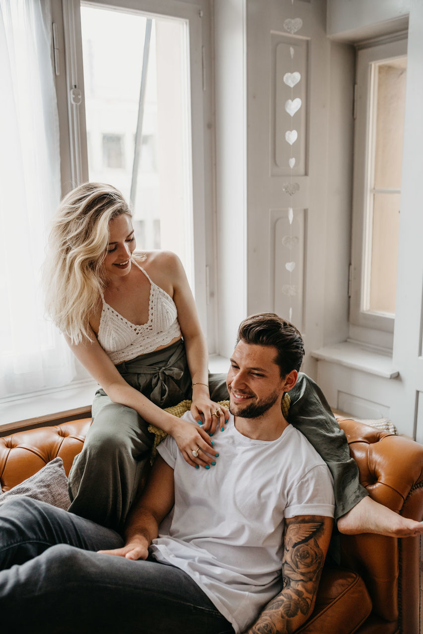 Loving young couple romancing at home