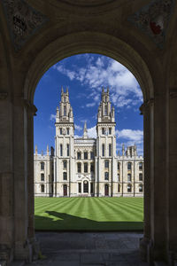 Cathedral seen through archway against sky