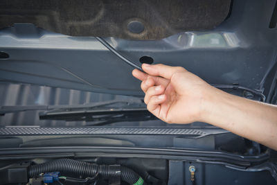 Auto mechanic checking car engine,worker selective focus