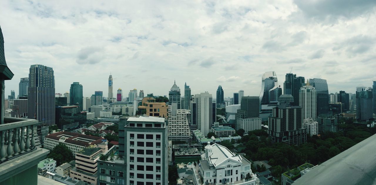 city, building exterior, architecture, cityscape, built structure, skyscraper, sky, modern, cloud - sky, office building, tall - high, crowded, high angle view, tower, city life, urban skyline, cloudy, cloud, residential building, residential district