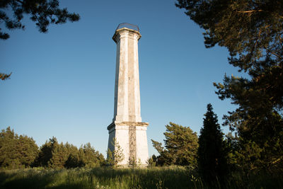 Low angle view of windmill against blue sky