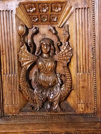 Ornate sculpture on door in temple