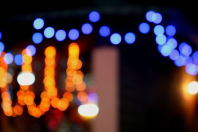 Defocused image of illuminated city at night
