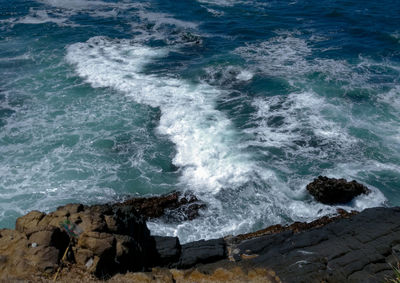 Waves breaking on rocks