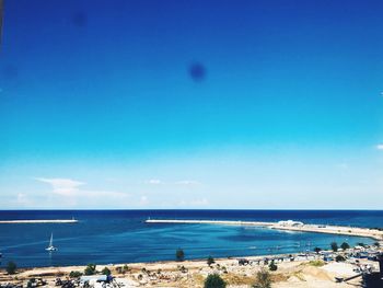 Scenic view of sea against blue sky