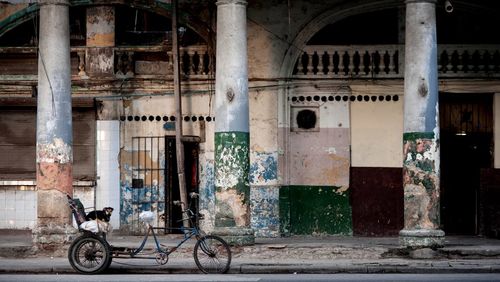 Bicycle in front of abandoned building