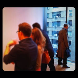 Rear view of man looking at camera