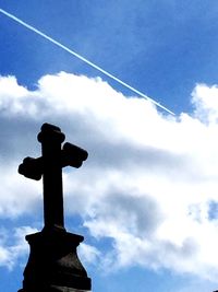 Low angle view of statue against cloudy sky