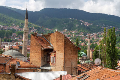 Buildings in city against sky